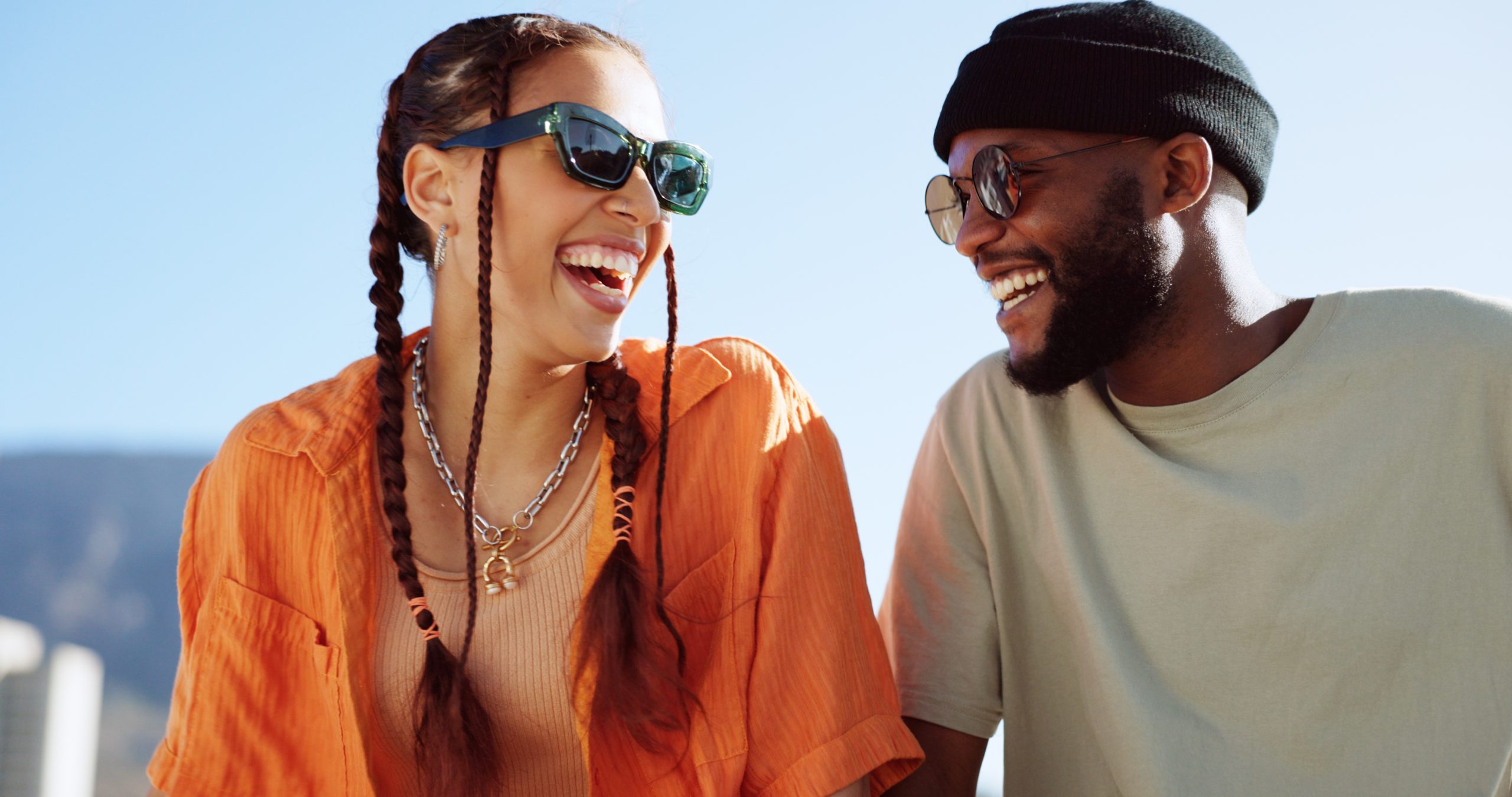 Couple laughing outdoors together